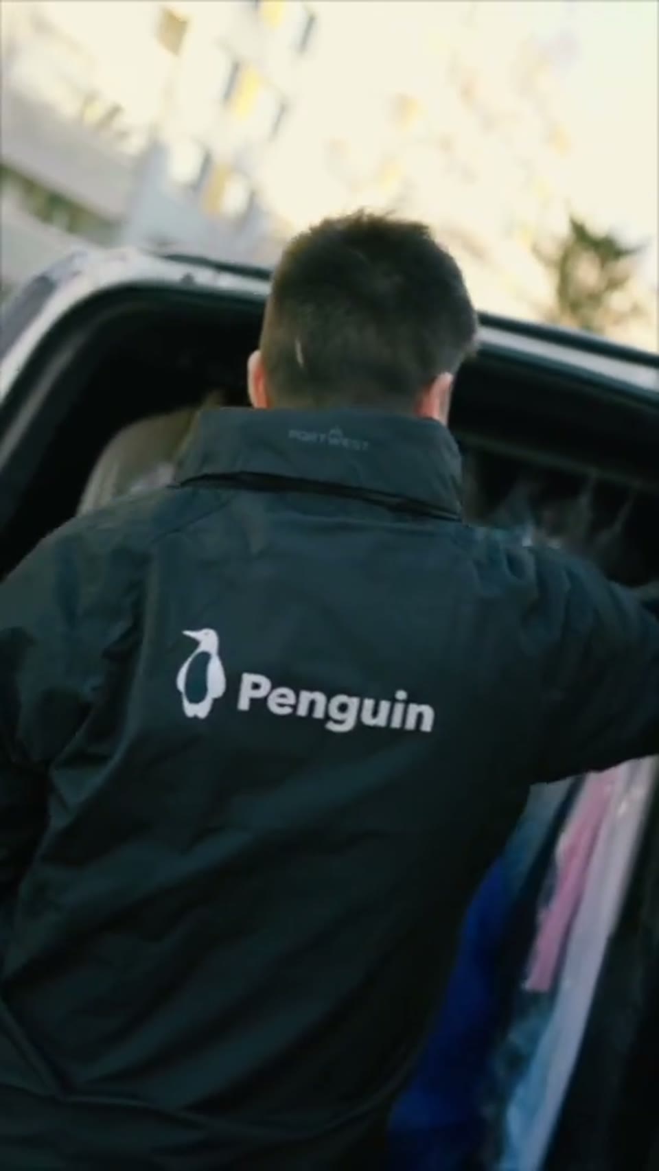 Penguin Online UGC video: a courier loads cleaned clothes into a van